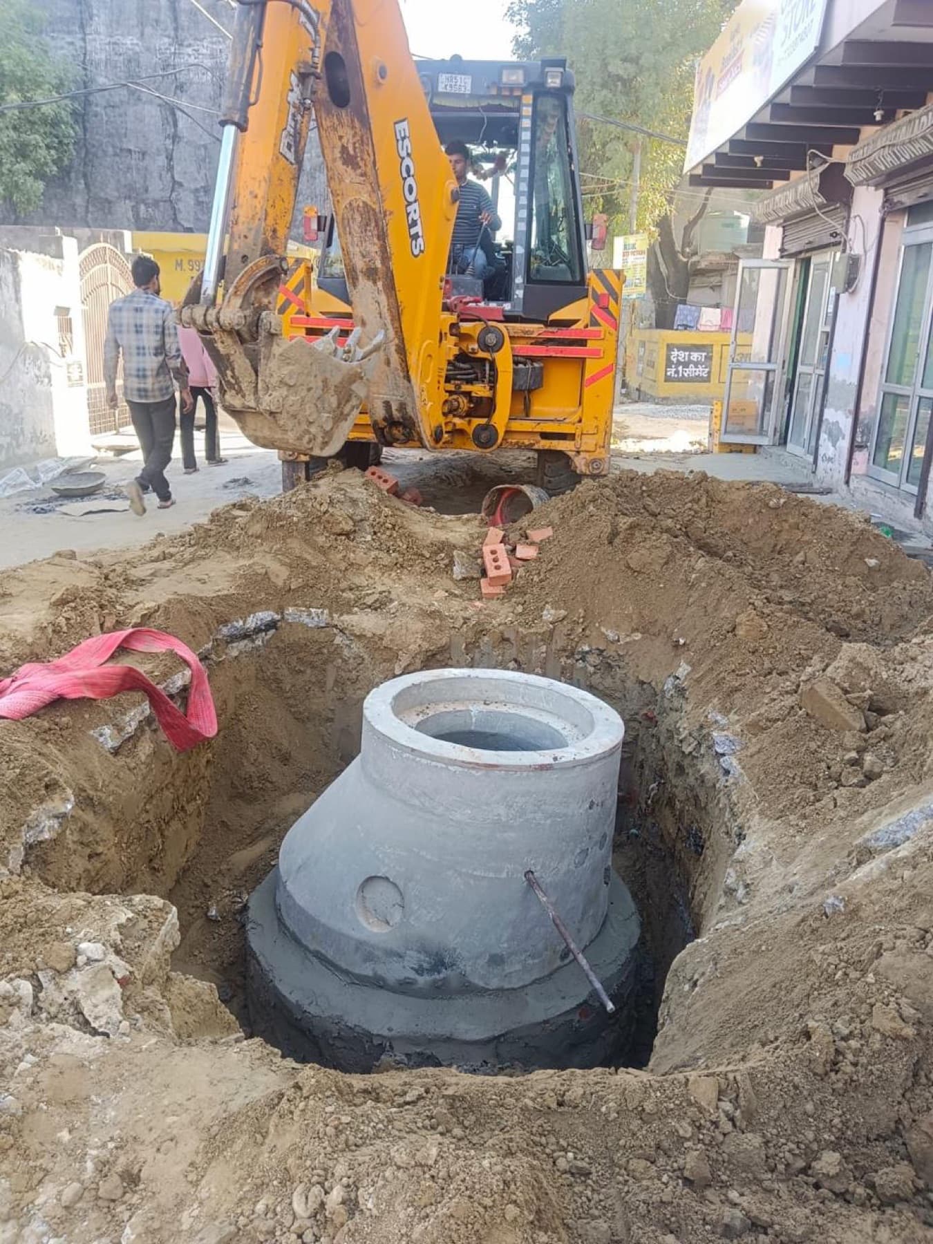 Lowering a precast chamber ring